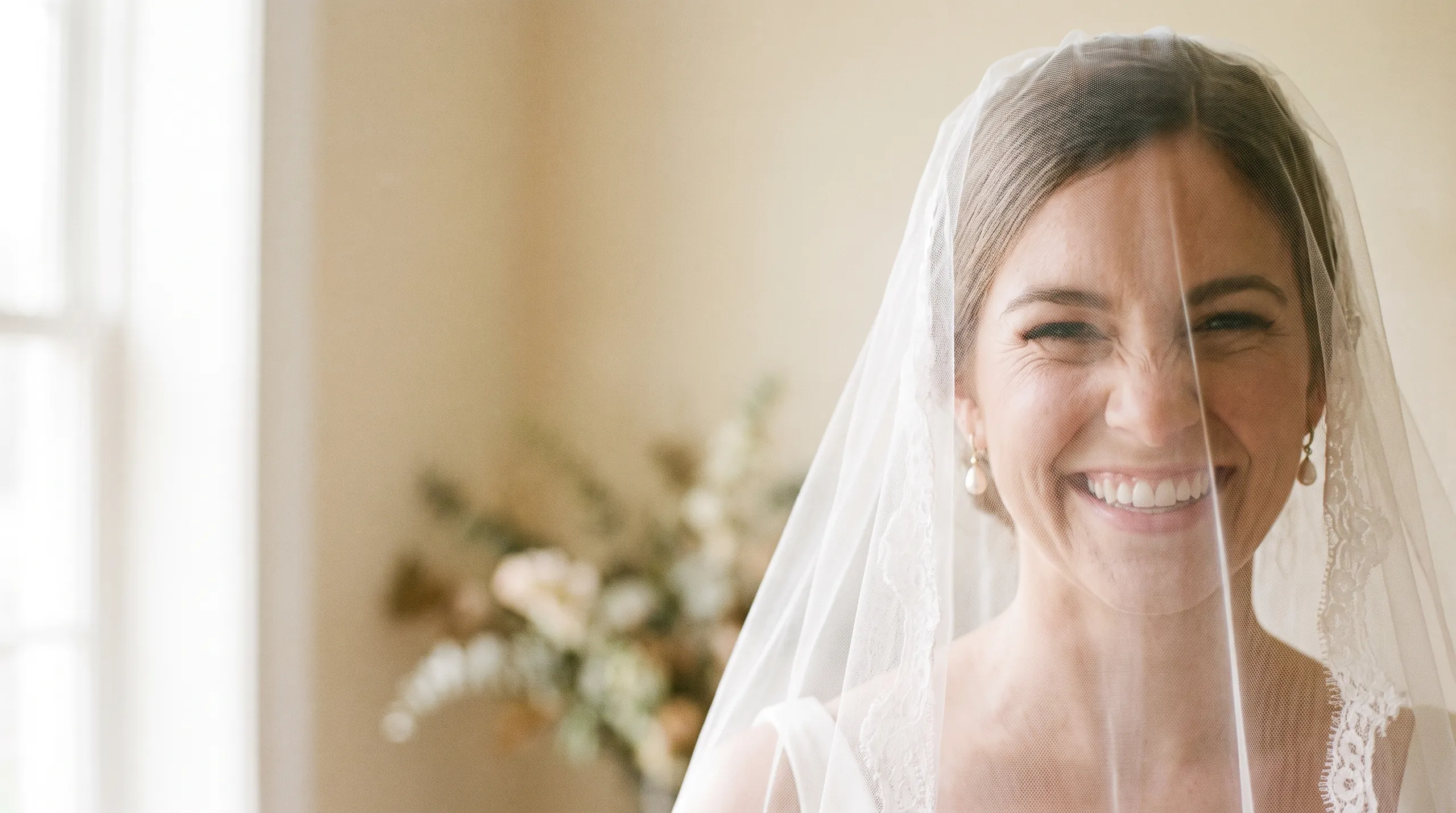 Bride smiling in soft natural light